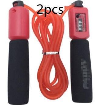 Red jump rope with black foam handles, digital counter, fitness accessory