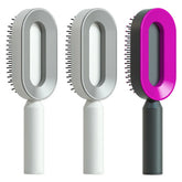 Modern oval hair brushes with ergonomic handles in white, gray, and pink color options.
