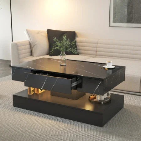 Modern black marble coffee table with storage drawers in contemporary living room setting