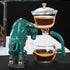 Green and gold bull-shaped ceramic tea set with glass teapot and cup, modern tabletop style