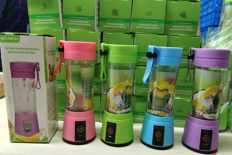 Assorted portable rechargeable blenders in pink, green, blue, and purple with clear plastic cups