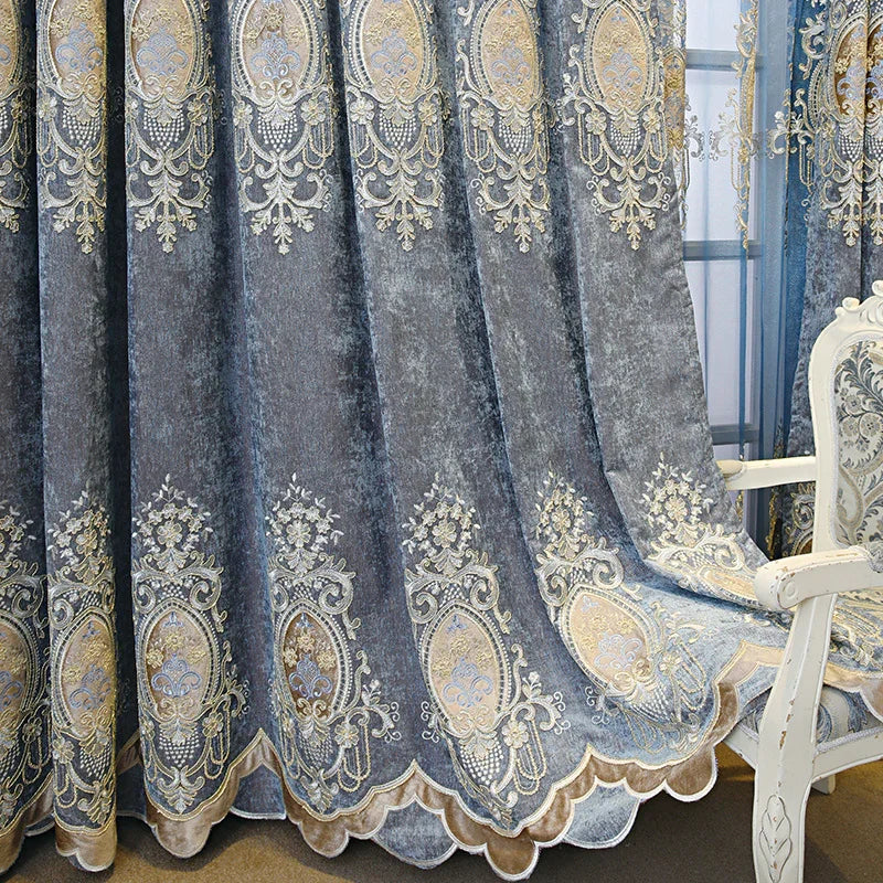 Blue velvet curtains with gold embroidered baroque pattern and scalloped edges