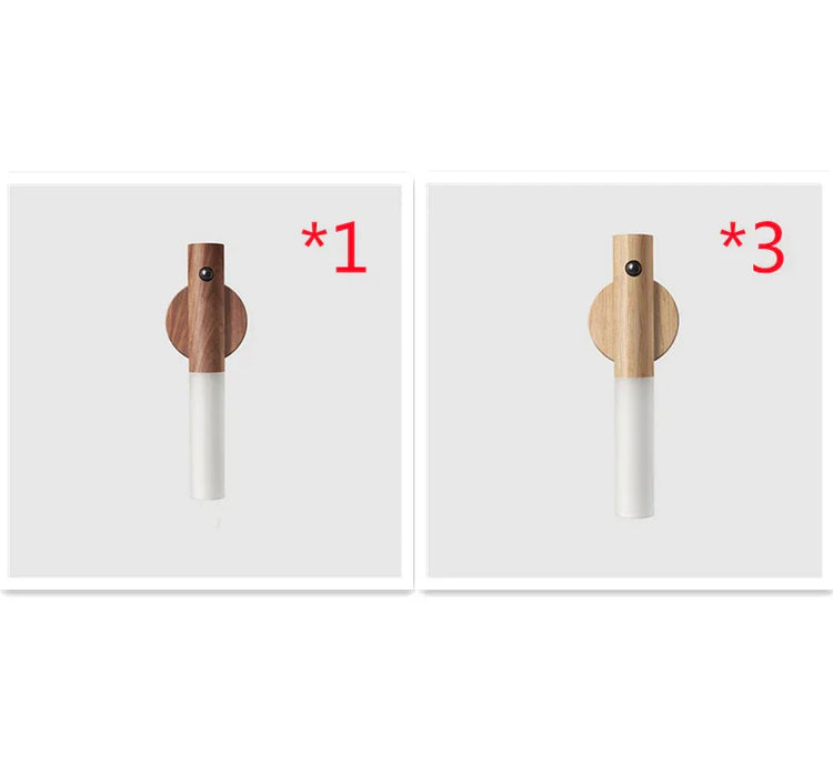 Minimalist wall hooks in dark and light wood with matte white cylindrical base, modern design