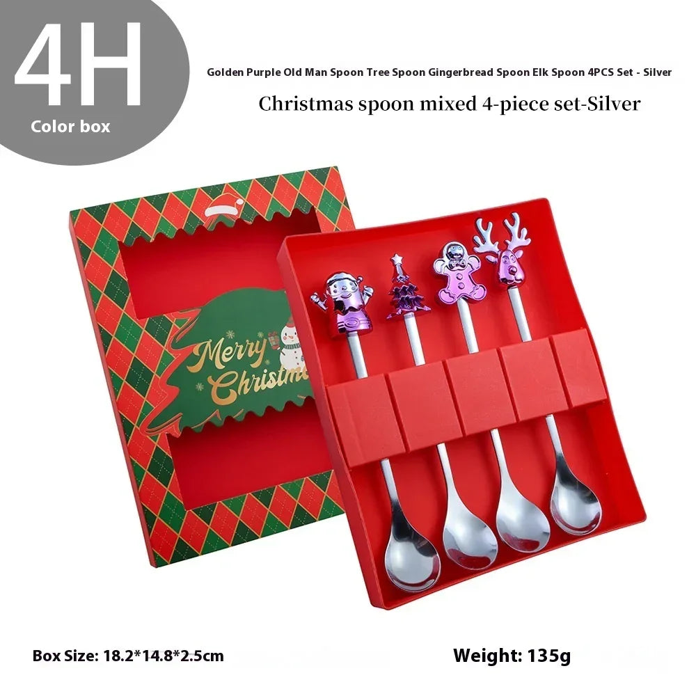 Set of four silver Christmas spoons with festive character handles in a red gift box