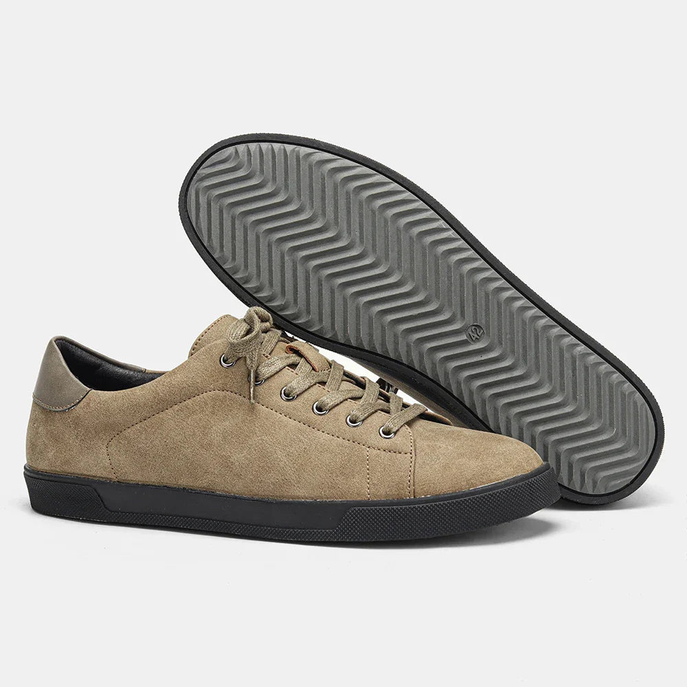 Beige suede low-top sneakers with black rubber sole and lace-up design, casual fit