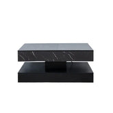 Modern black marble coffee table with white veining, sleek rectangular design
