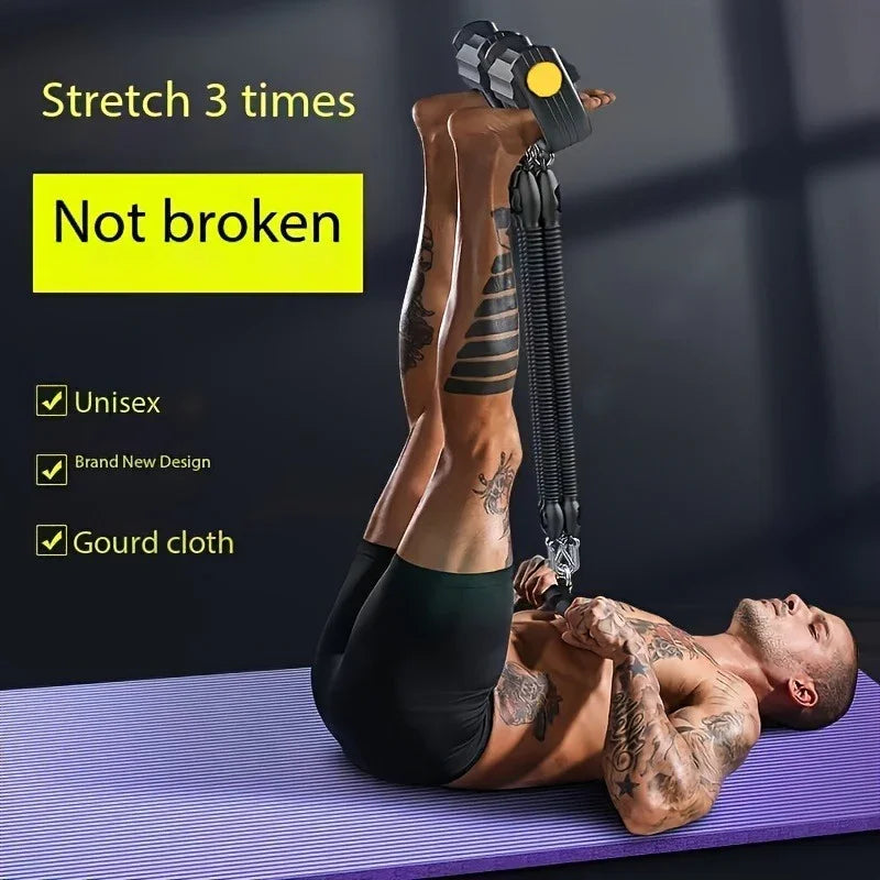 Man wearing fitted black athletic shorts, using resistance fitness band, on exercise mat indoors.