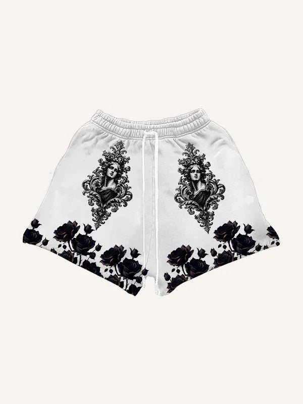 White streetwear shorts with black baroque portrait and floral rose patterns, relaxed fit