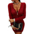 Woman wearing fitted red cable-knit sweater dress with zipper front and long sleeves