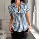 Blue and white gingham short-sleeve button-up blouse with chest pockets and fitted silhouette