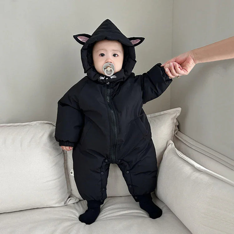 Baby in black hooded onesie with cat ear details, puffer material, relaxed fit