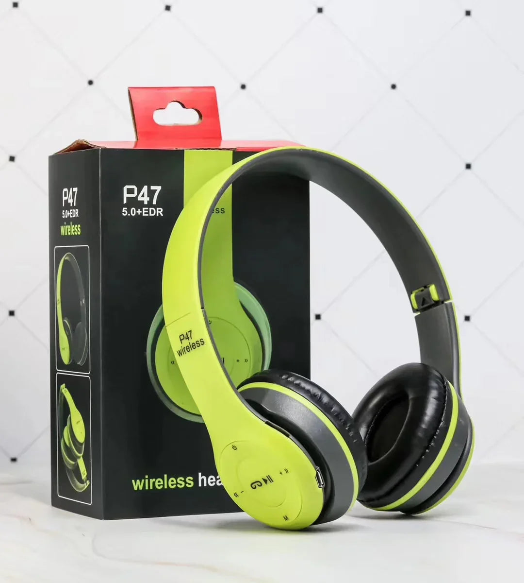 Lime green wireless over-ear headphones with cushioned ear pads, shown with retail box.
