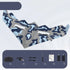 Blue and gray camouflage remote control airplane with accessories including controller, charger, propellers, screwdriver, manual, and batteries.