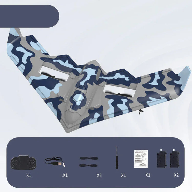Blue and gray camouflage remote control airplane with accessories including controller, charger, propellers, screwdriver, manual, and batteries.
