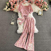 Pink floral two-piece set with tie waist top and wide-leg pants, soft fabric, feminine fit