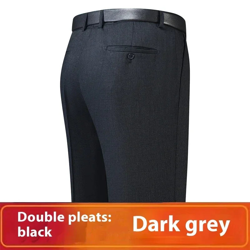 Dark grey tailored pants with double pleats, slim fit, single back pocket, and belt loops.