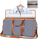 Navy and white striped weekender bag with brown leather straps, zipper closure, and detachable shoulder strap, shown with a dress shirt inside and a mesh toiletry pouch nearby.