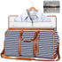 Navy and white striped weekender bag with brown leather straps, zipper closure, and detachable shoulder strap, shown with a dress shirt inside and a mesh toiletry pouch nearby.