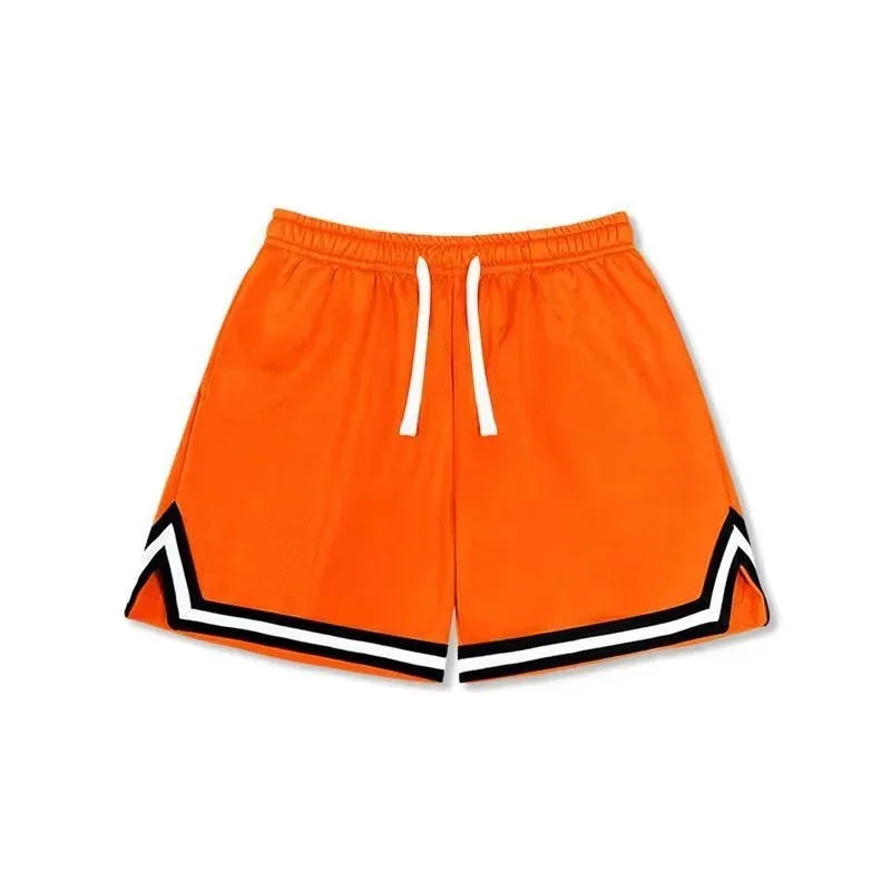 Bright orange athletic shorts with white drawstring, black and white chevron hem accents, relaxed fit