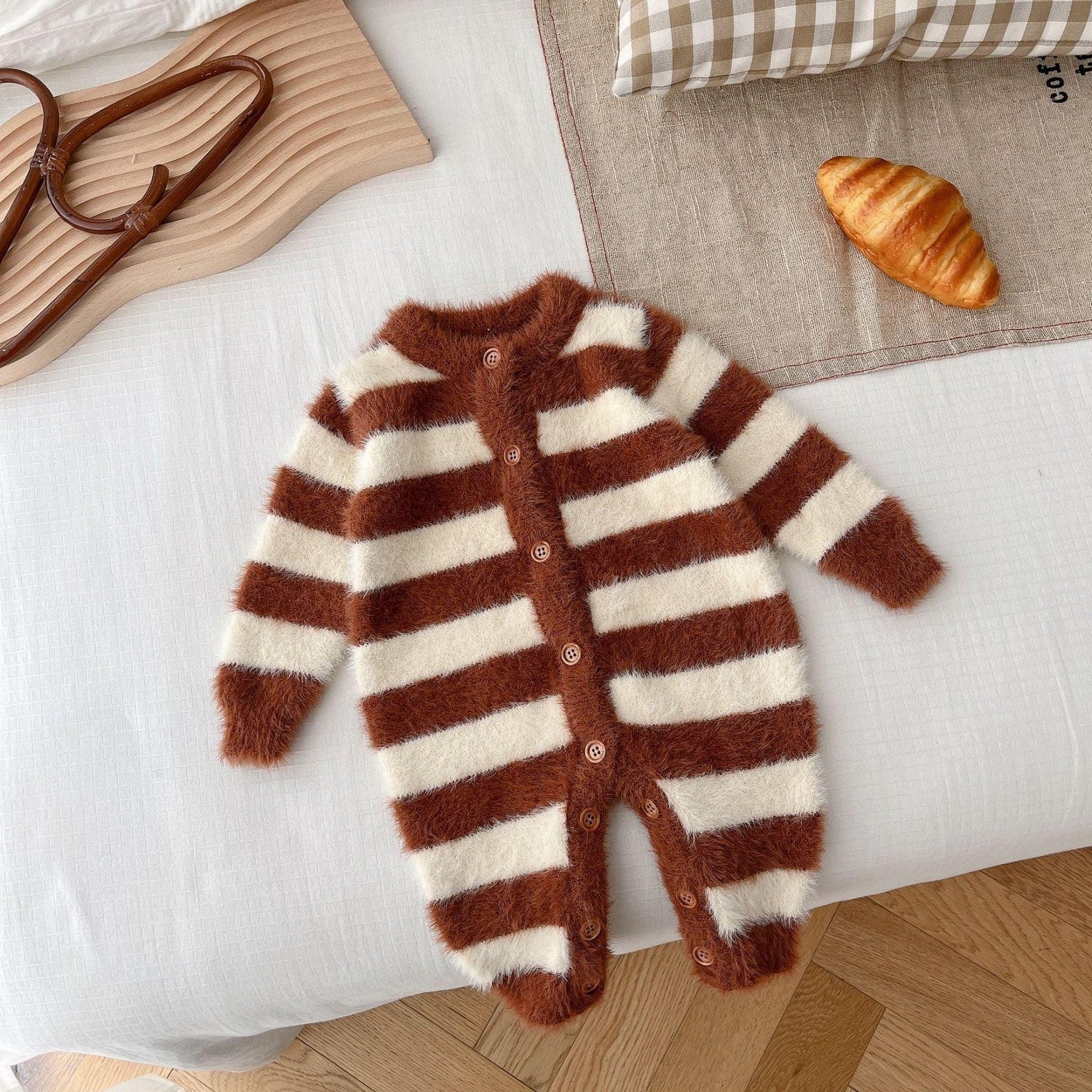 Brown and white striped fuzzy baby romper with button front, cozy and soft material