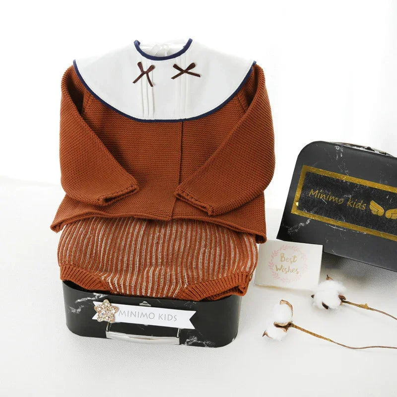 Brown knit long-sleeve baby outfit with white collar and striped bottom, relaxed fit