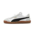 White and black low-top sneaker with gum sole and suede details, casual streetwear style