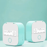Compact mint green and white portable label printers with minimalist design on pastel background