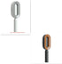Modern oval hairbrushes in white and brown, featuring sleek plastic handles and fine bristles.