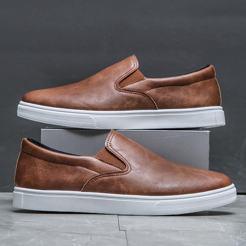 Men’s brown leather slip-on sneakers with white rubber soles, casual streetwear style