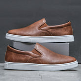 Men’s brown leather slip-on sneakers with white rubber soles, casual streetwear style