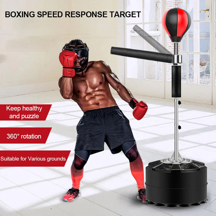 Athletic man in black shorts and red gloves using a boxing reflex trainer indoors