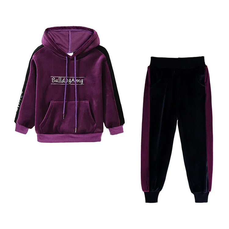Purple and black velvet hoodie and jogger set with relaxed fit and streetwear style