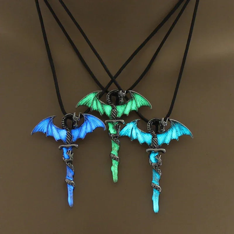 Glow-in-the-dark dragon wing sword pendant necklaces in blue and green on black cords