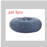 Round gray mesh pet bed with soft, textured material, donut shape, suitable for pets.