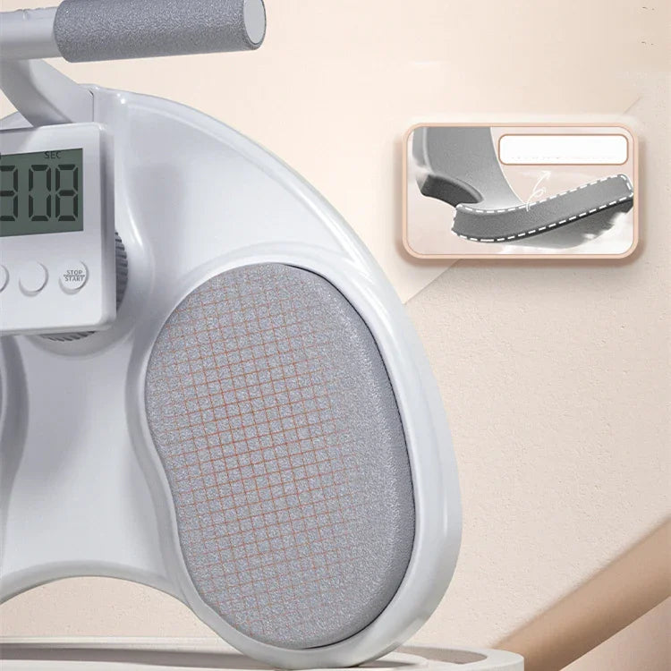 Close-up of a gray exercise machine with soft padded handles and textured cushion seat