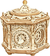 Intricately detailed wooden music box with ornate design and ballerina figure, hexagonal shape