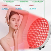 Woman using red LED light therapy device on bare shoulder, showing skin care treatment