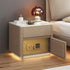 Modern beige nightstand with marble top, built-in safe, and warm ambient lighting.