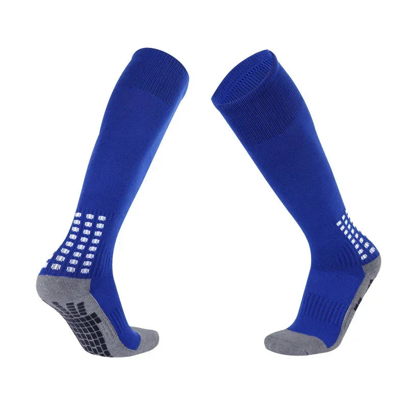 Blue knee-high athletic socks with gray cushioned soles and non-slip grip pads