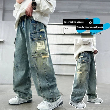 Baggy light wash denim cargo jeans with patch pockets, relaxed fit, worn with white sneakers.