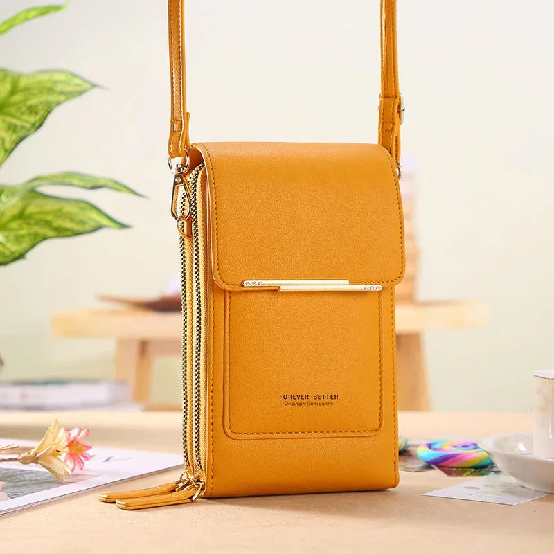 Yellow faux leather crossbody bag with zipper details and slim modern fit