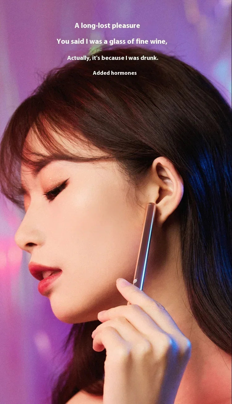 Woman wearing bold makeup and holding a sleek metallic accessory, glam streetwear style