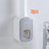 Wall-mounted gray and white plastic dispenser with modern design, suitable for liquids