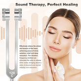 Woman in beige top with smooth, fitted fabric enjoying sound therapy relaxation, minimal background.