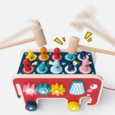 Colorful wooden whack-a-mole toy with animal pegs and gears, playful learning activity