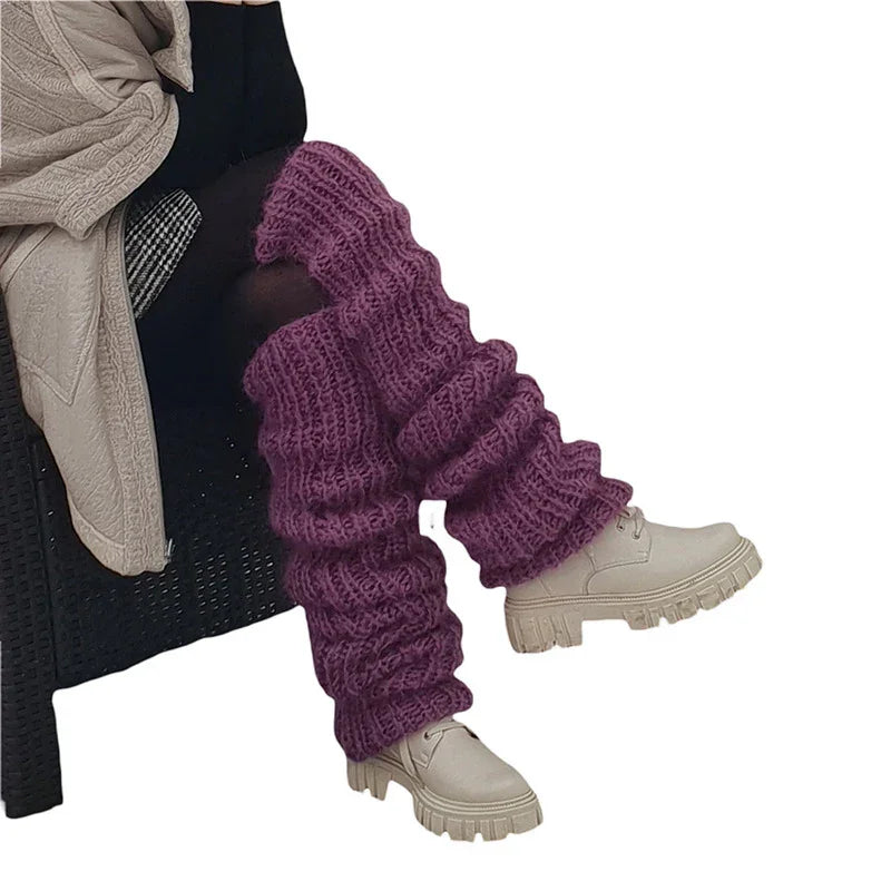 Purple knit leg warmers with chunky texture, paired with off-white platform boots