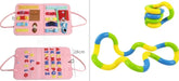 Pink sensory busy board with colorful buckles, zippers, letters, and tangled fidget toy