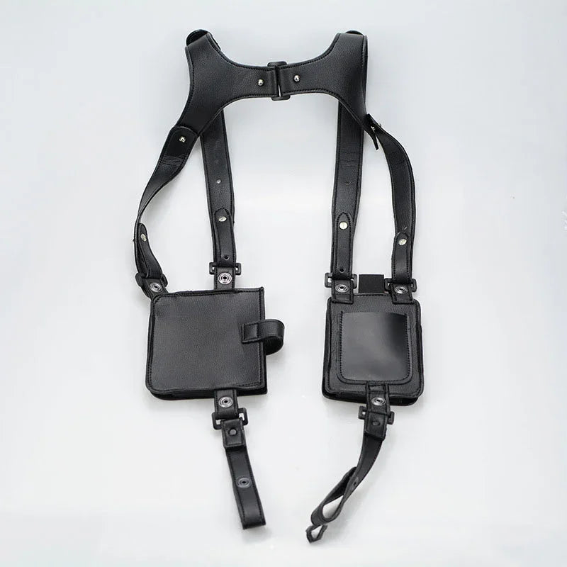 Black faux leather utility harness with adjustable straps and two square pockets, streetwear style