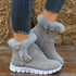 Gray faux fur-lined ankle boots with suede finish and rubber soles, worn with skinny jeans