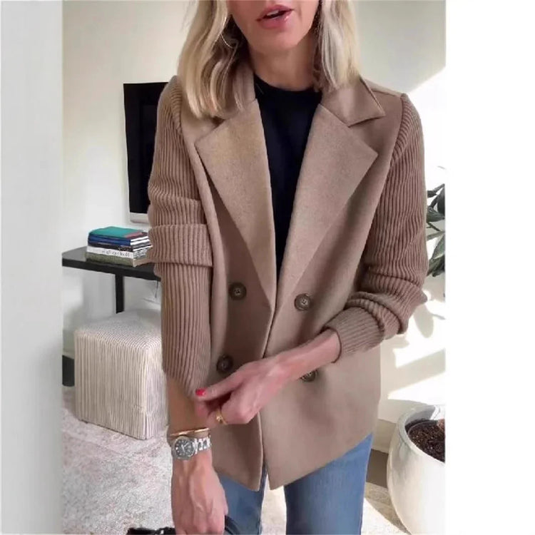 Woman wearing a camel double-breasted blazer with ribbed knit sleeves and relaxed fit